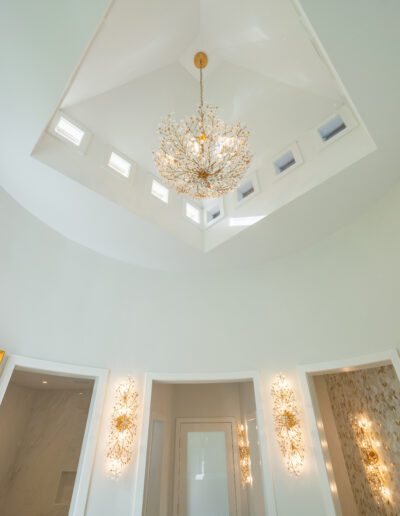 Interior bathroom ceiling with a fancy chandelier