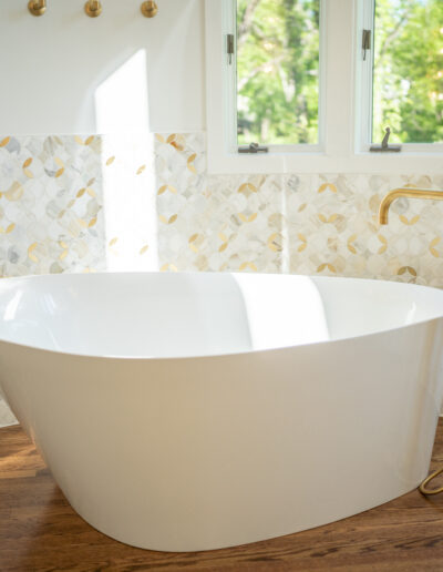 Modern bathtub with gold trim